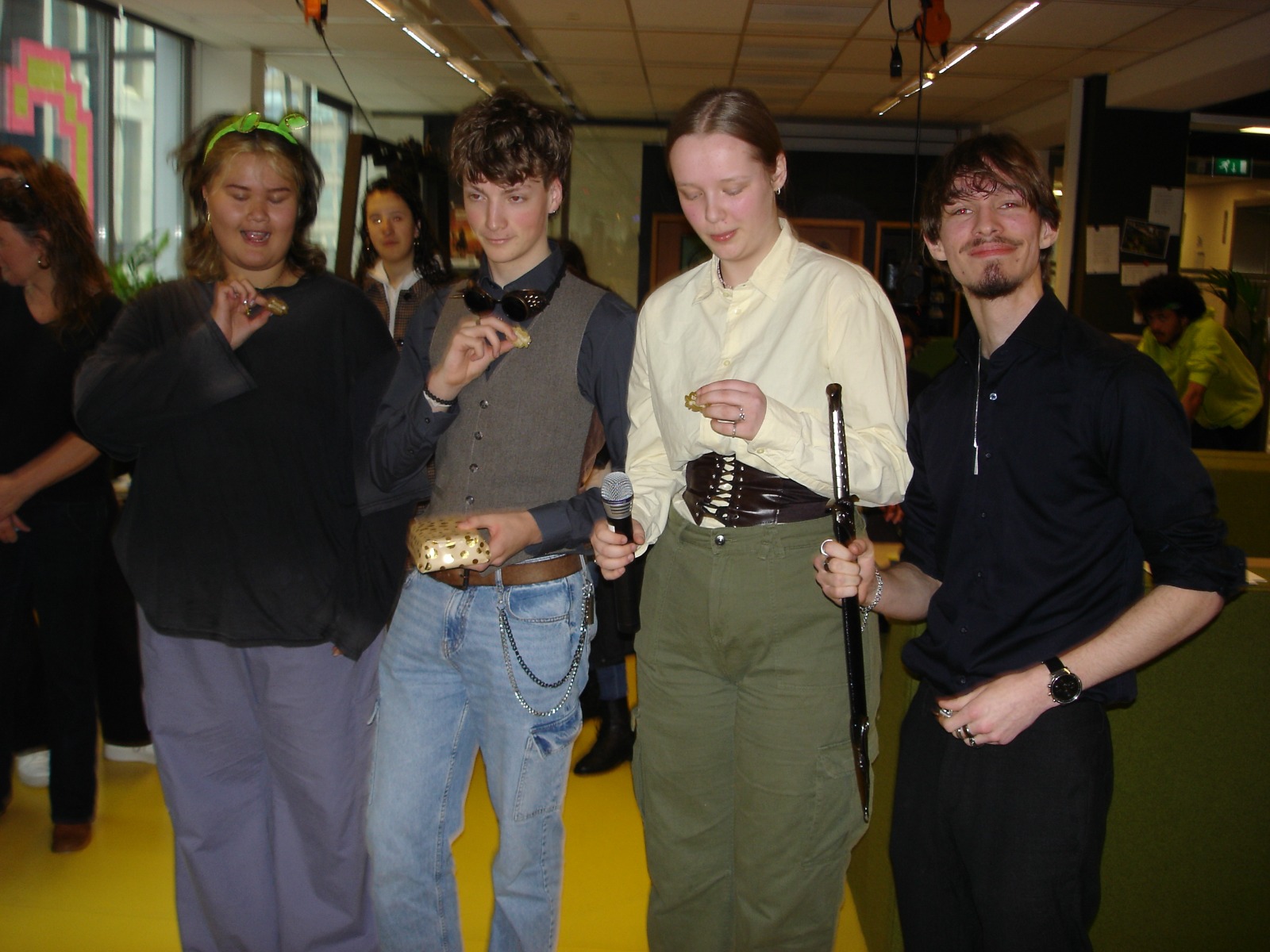 the group posing with the winners prize